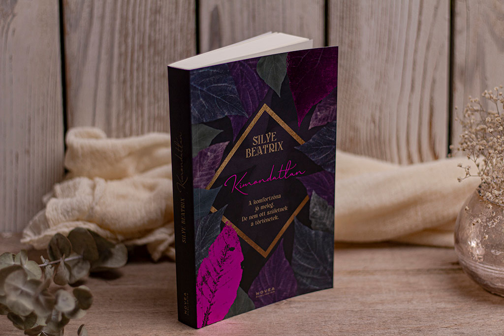 A Kimondatlan regény teljes körű könyvtervezése: szöveggondozás, profi tördelés és egyedi borítótervezés látványos lila-pink fóliaprégeléssel.
