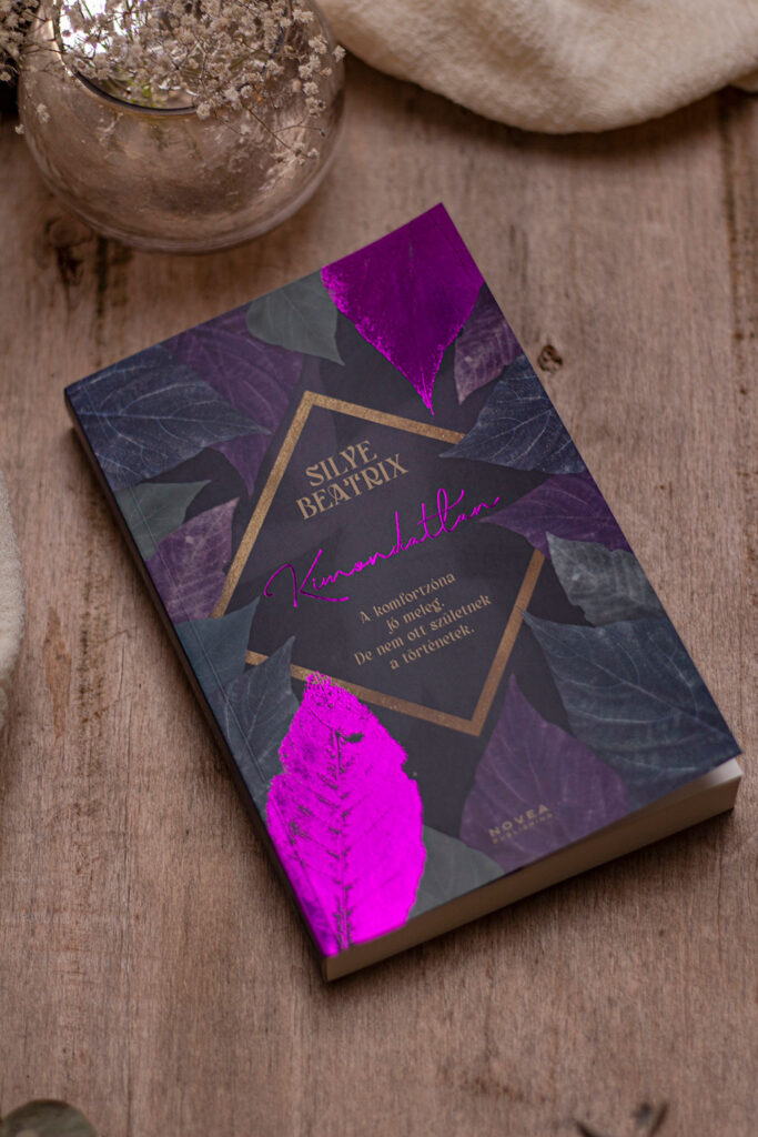 A Kimondatlan regény teljes körű könyvtervezése: szöveggondozás, profi tördelés és egyedi borítótervezés látványos lila-pink fóliaprégeléssel.